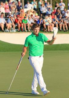 Golf: Masters Tournament Bryson DeChambeau of the United States acknowledges the gallery after making a birdie on the 18th hole during the first round of the Masters Tournament at Augusta National Golf Club in Augusta, Georgia, on April 11, 2019. DeChambeau and American compatriot Brooks Koepka shared the first-round lead. 
