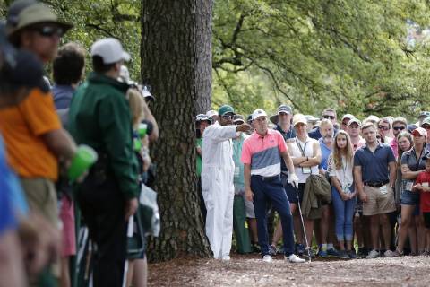 Jordan Spieth stands in the pine straw to play his 2nd shot on the first hole in the second round at the 2019 Masters Tournament at Augusta National Golf Club in Augusta, Georgia, on April 12, 2019.  AUG20190412101 JOHNxANGELILLO