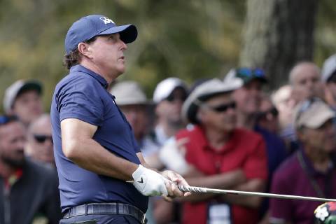 Phil Mickelson hits his approach shot to the first hole second round at the 2019 Masters Tournament at Augusta National Golf Club in Augusta, Georgia, on April 12, 2019.  AUG20190412108 JOHNxANGELILLO