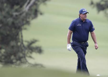 Phil Mickelson walks on the 1st hole fairway in the second round at the 2019 Masters Tournament at Augusta National Golf Club in Augusta, Georgia, on April 12, 2019.  AUG20190412109 JOHNxANGELILLO