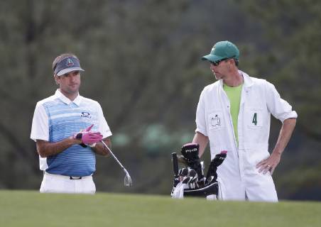 Bubba Watson stands with caddie Ted Scott in the second round at the 2019 Masters Tournament at Augusta National Golf Club in Augusta, Georgia, on April 12, 2019.  AUG20190412111 JOHNxANGELILLO