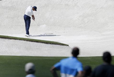 Tiger Woods hits out of a fairway bunker on the 8th hole in the second round at the 2019 Masters Tournament at Augusta National Golf Club in Augusta, Georgia, on April 12, 2019.  AUG20190412122 JOHNxANGELILLO
