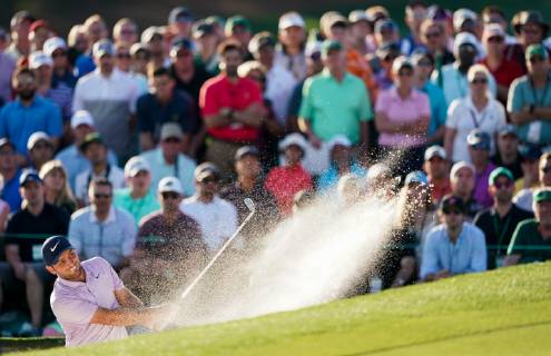 Francesco Molinari hits out of a bunker on the 18th fairway during the third round of the Masters Tournament at Augusta National Golf Club in Augusta, Georgia, on April 13, 2019.  AUG201904133335 KEVINxDIETSCH