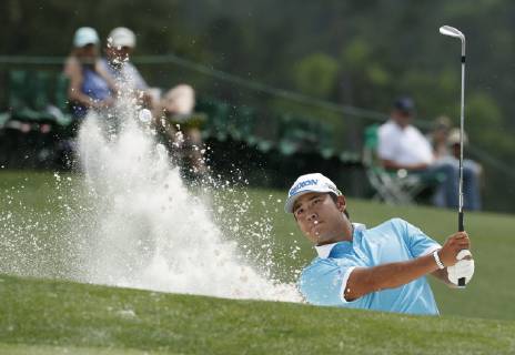 Golf: Masters Tournament Hideki Matsuyama of Japan hits a bunker shot on the 18th hole during the third round of the Masters Tournament at Augusta National Golf Club in Augusta, Georgia, on April 13, 2019. 
