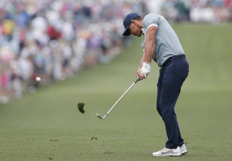 Brooks Koepka hits his approach shot to the 1st hole in the final round at the 2019 Masters Tournament at Augusta National Golf Club in Augusta, Georgia, on April 14, 2019.  AUG20190414906 JOHNxANGELILLO