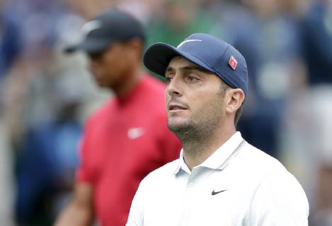 Francesco Molinari of Italy and Tiger Woods walk to play a second shot after hitting their tee balls on the 1st hole in the final round at the 2019 Masters Tournament at Augusta National Golf Club in Augusta, Georgia, on April 14, 2019.  AUG20190414910 JOHNxANGELILLO