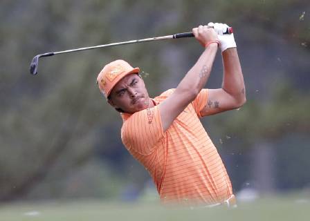 Rickie Fowler hits his approach shot to the 1st hole in the final round at the 2019 Masters Tournament at Augusta National Golf Club in Augusta, Georgia, on April 14, 2019.  AUG20190414912 JOHNxANGELILLO