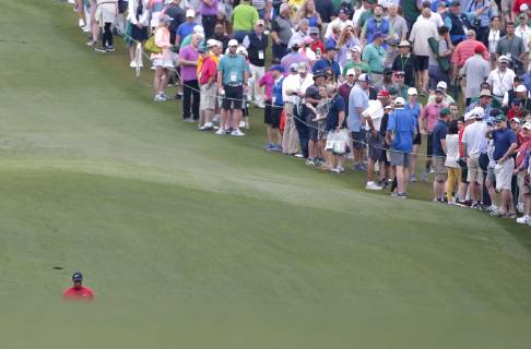 Tiger Woods walks to his ball on the first hole in the final round at the 2019 Masters Tournament at Augusta National Golf Club in Augusta, Georgia, on April 14, 2019.  AUG20190414913 JOHNxANGELILLO