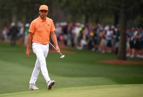 Rickie Fowler walks on the first green during the final round of the Masters Tournament at Augusta National Golf Club in Augusta, Georgia, on April 14, 2019.  AUG20190414301 KEVINxDIETSCH