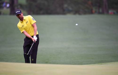 Webb Simpson chips on the first fairway during the final round of the Masters Tournament at Augusta National Golf Club in Augusta, Georgia, on April 14, 2019.  AUG20190414308 KEVINxDIETSCH