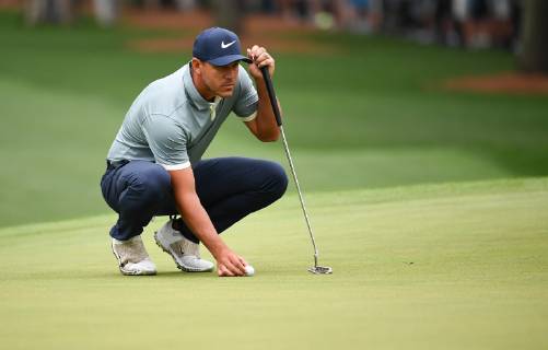 Brooks Koepka lines up a putt on the first green during the final round of the Masters Tournament at Augusta National Golf Club in Augusta, Georgia, on April 14, 2019.  AUG20190414310 KEVINxDIETSCH