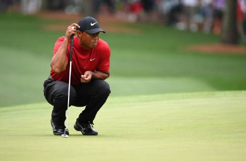 Tiger Woods lines up a putt on the first green during the final round of the Masters Tournament at Augusta National Golf Club in Augusta, Georgia, on April 14, 2019.  AUG20190414317 KEVINxDIETSCH