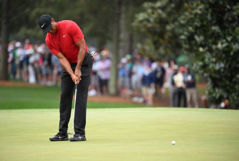 Tiger Woods putts on the first green during the final round of the Masters Tournament at Augusta National Golf Club in Augusta, Georgia, on April 14, 2019.  AUG20190414318 KEVINxDIETSCH
