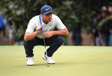 Francesco Molinari lines up a putt on the first green during the final round of the Masters Tournament at Augusta National Golf Club in Augusta, Georgia, on April 14, 2019.  AUG20190414319 KEVINxDIETSCH