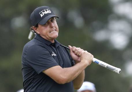 Sport Bilder des Tages Phil Mickelson reacts after missing a birdie putt on the 9th green in the final round at the 2019 Masters Tournament at Augusta National Golf Club in Augusta, Georgia, on April 14, 2019. Tiger Woods wins the Masters with a score of 13 under par for his 5th Green Jacket.  AUG20190414945 JOHNxANGELILLO
