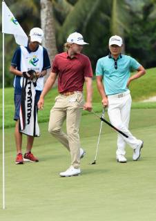 (190420) -- BOAO, April 20, 2019 (Xinhua) -- Maverick Antcliff (C) of Australia and Xiao Bowen (R) of China react on the 5th hole during the third round of the Boao Open in Boao, south China s Hainan Province, on April 20, 2019. The 2019 China Tour s Boao Open is held from April 15 to 21. (Xinhua Yang Guanyu) (SP)CHINA-BOAO-GOLF-CHINA TOUR-BOAO OPEN (CN) 