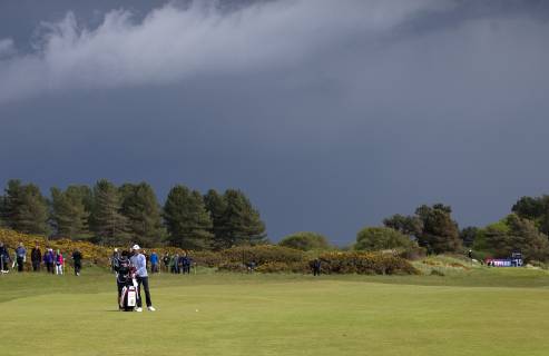 10th May 2019, Hillside Golf Club, Southport, England; Betfred British Masters, hosted by Tommy Fleetwood, day 2; Pedro Figuerdro (POR) prepares to hit his second shot to the 15th green under a dark sky  ActionPlus12133159 DavidxBlunsden