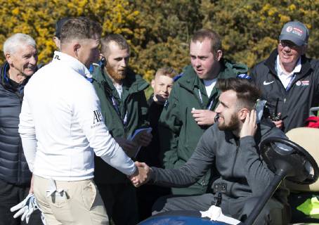11th May 2019, Hillside Golf Club, Southport, England; Betfred British Masters, hosted by Tommy Fleetwood, day 3; Matt Wallace (ENG) shakes hands and apologies to a spectator who required first aid after he was hit on the back of the neck by Wallace s tee shot on the par four 15th hole  ActionPlus12133758 DavidxBlunsden