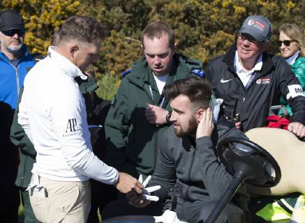 11th May 2019, Hillside Golf Club, Southport, England; Betfred British Masters, hosted by Tommy Fleetwood, day 3; Matt Wallace (ENG) offers his glove to a spectator by way of apology after he was hit on the back of the neck by Wallace s tee shot on the par four 15th hole  ActionPlus12133759 DavidxBlunsden