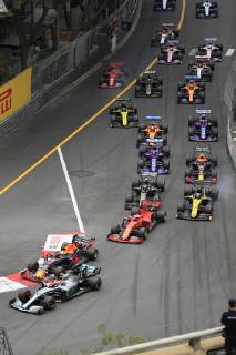 Driver field of the Formula 1 Grand Prix in the Principality of Monaco shortly after the start at the end of the start home straight and before the Ste Devote curve, Cote dÂ Azur, Mediterranean Sea