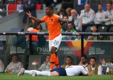 Netherlands v England UEFA Nations League Semi-Final Denzel Dumfries of Netherlands fouls Ben Chilwell of England during the UEFA Nations League Semi-Final match at Estadio D. Afonso Henrique, Guimaraes Content Not Available For UK Newspapers Copyright: xPaulxChestertonx FIL-13327-0056