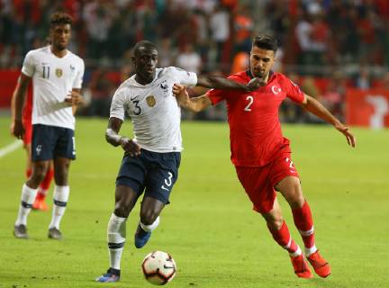 Zeki Celik (R) of Turkey and Ferland Mendy of France during the Euro 2020 football qualification match between Turkey and France at the Buyuksehir Belediyesi stadium in Konya, on June 8, 2019. 
