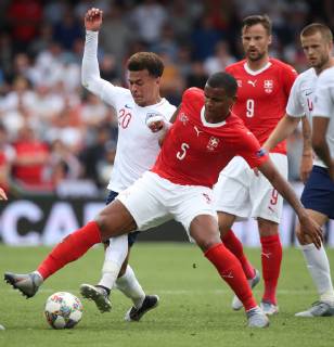 Switzerland v England UEFA Nations League 3rd Place Play-off Dele Alli of England and Manuel Akanji of Switzerland in action during the UEFA Nations League 3rd Place Play-off match at Estadio D. Afonso Henrique, Guimaraes Content Not Available For UK Newspapers Copyright: xPaulxChestertonx FIL-13338-0025