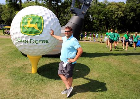 July 13, 2019 - Silvis, Iowa, USA - J.D. Mudd of Colona, Illinois was one of the thousands of golf fans to pose with the John Deere giant golf ball near the 9th green during the third round of the John Deere Classic at TPC Deere Run in Silvis, Illinois Saturday, July 13, 2019. Golf 2019: John Deere Classic Iowa - ZUMAq30_ 20190713_zaf_q30_019 Copyright: xKevinxE.xSchmidtx