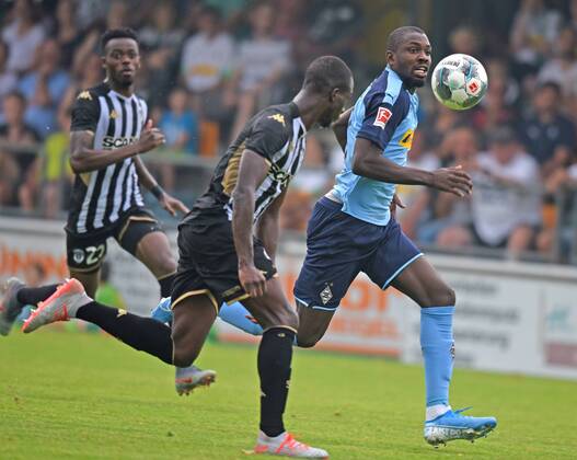 Test match Borussia Mönchengladbach SCO Angers France 27 07 2019 Marcus Thuram BMG Action in front of Ibrahim Cisse Angers DFL REGULATIONS PROHIBIT ANY USE OF PHOTOGRAPHS AS IMAGE SEQUENCES AND OR QUASI VIDEO HM