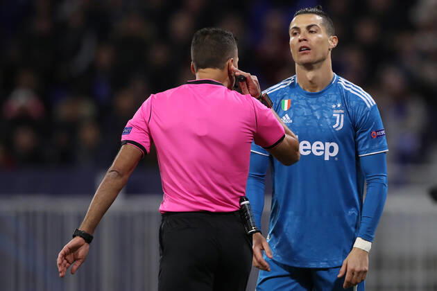 Juventus s Portuguese striker Cristiano Ronaldo reacts in front of Spanish referee Gil Manzano during the UEFA Champions League match at the Groupama Stadium, Lyon. Picture date: 26th February 2020. Picture credit should read: Jonathan Moscrop Sportimage EDITORIAL USE ONLY. No use with unauthorised audio, video, data, fixture lists, club league logos or live services. Online in-match use limited to 120 images, no video emulation. No use in betting, games or single club league player publications. SPI-0491-0094