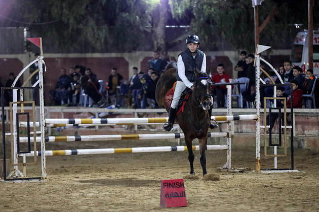February 27, 2020, Gaza City, Gaza Strip, Palestinian Territory: A Palestinian horse rider on his horse jumps over a barrier during the first championship in jump barriers for the year 2020, on February 27, 2020 Middle East News - February 27, 2020 - ZUMAap3_ 97337380st Copyright: xMahmoudxAjjourx