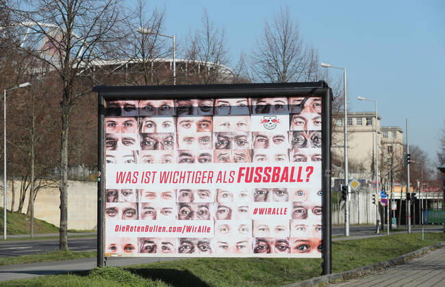 RBL Wir alle Leipzig, 26 03 2020, RB Leipzig Solidarity in the Corona Crisis What is more important than football We all The health of all goes before the campaign of football Bundesliga club RasenBallsport Leipzig , In the picture Wiralle poster In the background the Red Bull Arena ,