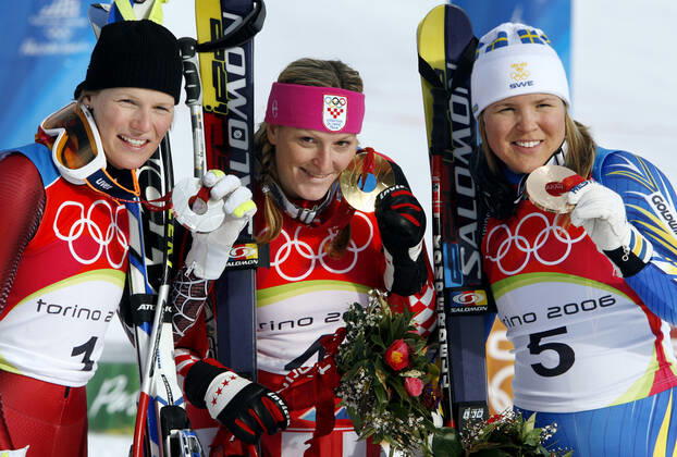 060218 Winter Olympics 2006, Alpine Skiing Gold medalist Janica Kostelic of Croatia is flanked by silver medalist Marlies Schild of Austria and bronze medalist Anja Parson of Sweden after womens alpine combination at The Winter Olympic Games on February 18, 2006 in Turin, Italy BILDBYRAN,  Copyright: DanielxNilsson BB060218DN040