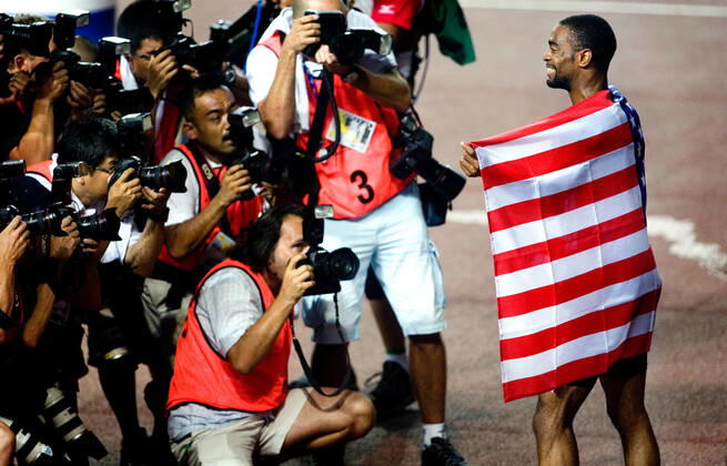 070826 Athletics, World Athletics Championships Gold medalist Tyson Gay of USA celebrate and pose for photographers after 100 m at The World Athletics Championships on August 26, 2007 in Osaka, Japan BILDBYRAN,  Copyright: EMILxMALMBORG BB070826EM017