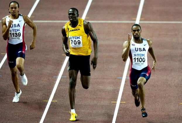 070830 Athletics, World Athletics Championships Gold medalist Tyson Gay of USA wins 200 m before silver medalist Usain Bolt of Jamaica and bronze medalist Wallace Spearmon of USA at The World Athletics Championships on August 30, 2007 in Osaka, Japan BILDBYRAN,  Copyright: EMILxMALMBORG BB070830EM038