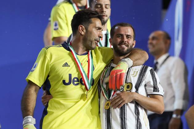 Gianluigi Buffon laughs with Miralem Pjanic of Juventus as they walk down from the terrace following the trophy presentation after the Serie A match at Allianz Stadium, Turin. Picture date: 1st August 2020. Picture credit should read: Jonathan Moscrop Sportimage EDITORIAL USE ONLY. No use with unauthorised audio, video, data, fixture lists, club league logos or live services. Online in-match use limited to 120 images, no video emulation. No use in betting, games or single club league player publications. SPI-0619-0042