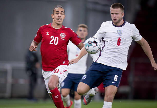Denmarks Yussuf Poulsen and Englands Eric Dier during the Nations League match between Denmark and England in the Park, Tuesday 8 September 2020, Copenhagen Denmark  Copyright: Ritzau Scanpix LiselottexSabroex COP101 spdk20200908-213842-L