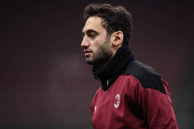 Hakan Calhanoglu of AC Milan during the warm up prior to the Coppa Italia match at Giuseppe Meazza, Milan. Picture date: 12th January 2021. Picture credit should read: Jonathan Moscrop Sportimage EDITORIAL USE ONLY. No use with unauthorised audio, video, data, fixture lists, club league logos or live services. Online in-match use limited to 120 images, no video emulation. No use in betting, games or single club league player publications. SPI-0842-0071