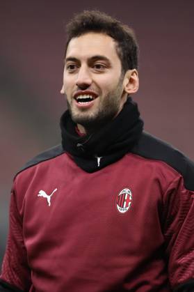 Hakan Calhanoglu of AC Milan during the warm up prior to the Coppa Italia match at Giuseppe Meazza, Milan. Picture date: 12th January 2021. Picture credit should read: Jonathan Moscrop Sportimage EDITORIAL USE ONLY. No use with unauthorised audio, video, data, fixture lists, club league logos or live services. Online in-match use limited to 120 images, no video emulation. No use in betting, games or single club league player publications. SPI-0842-0073