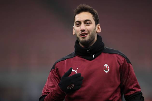 Hakan Calhanoglu of AC Milan during the warm up prior to the Coppa Italia match at Giuseppe Meazza, Milan. Picture date: 12th January 2021. Picture credit should read: Jonathan Moscrop Sportimage EDITORIAL USE ONLY. No use with unauthorised audio, video, data, fixture lists, club league logos or live services. Online in-match use limited to 120 images, no video emulation. No use in betting, games or single club league player publications. SPI-0842-0074