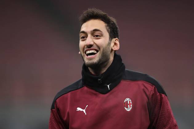 Hakan Calhanoglu of AC Milan during the warm up prior to the Coppa Italia match at Giuseppe Meazza, Milan. Picture date: 12th January 2021. Picture credit should read: Jonathan Moscrop Sportimage EDITORIAL USE ONLY. No use with unauthorised audio, video, data, fixture lists, club league logos or live services. Online in-match use limited to 120 images, no video emulation. No use in betting, games or single club league player publications. SPI-0842-0079
