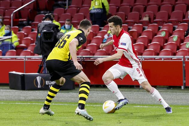 AMSTERDAM , 11}-03-2021 , Johan Cruijff Arena , Dutch football , Europa League , round of sixteen first leg , season 2020 2021. (R-L) Ajax player Oussama Idrissi and Young Boys player Silvan Hefti during the match Ajax vs Young Boys Ajax - Young Boys  x11071739x Copyright: