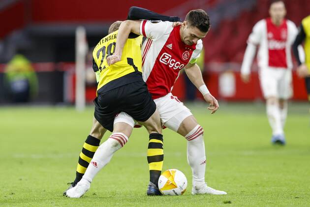AMSTERDAM , 11-03-2021 , Johan Cruijff Arena , Dutch football , Europa League , round of sixteen first leg , season 2020 2021. (R-L)Ajax player Dusan Tadic and Young Boys player Fabian Lustenberger during the match Ajax vs Young Boys Ajax - Young Boys  x11072507x Copyright:
