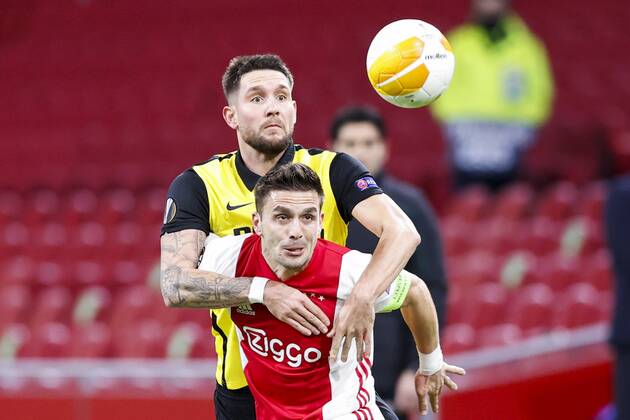 AMSTERDAM , 11-03-2021 , Johan Cruijff Arena , Dutch football , Europa League , round of sixteen first leg , season 2020 2021. (L-R) Young Boys player Jordan Lefort and Ajax player Dusan Tadic during the match Ajax vs Young Boys Ajax - Young Boys  x11074710x Copyright: