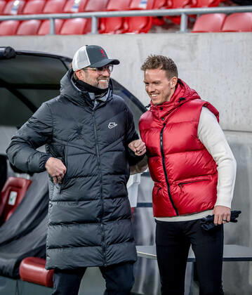 Liverpool coach Juergen Klopp and Leipzig coach Julian Nagelsmann stand together and talk UEFA Champions League Round of 16, second leg FC Liverpool RB Leipzig 2 0 10 03 2021, Puskas Arena in Budapest Hungary FC Liverpool RB Leipzig