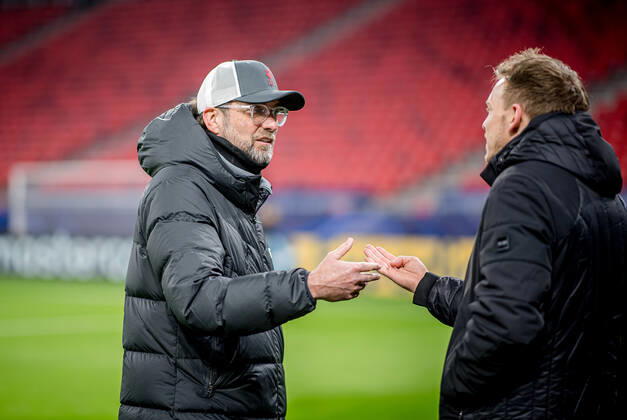 Liverpool coach Juergen Klopp and Leipzig coach Julian Nagelsmann stand together and talk UEFA Champions League Round of 16, second leg FC Liverpool RB Leipzig 2 0 10 03 2021, Puskas Arena in Budapest Hungary FC Liverpool RB Leipzig