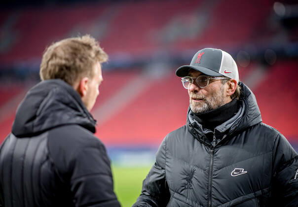 Liverpool coach Juergen Klopp and Leipzig coach Julian Nagelsmann stand together and talk UEFA Champions League Round of 16, second leg FC Liverpool RB Leipzig 2 0 10 03 2021, Puskas Arena in Budapest Hungary FC Liverpool RB Leipzig