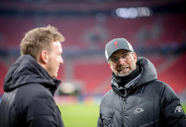 Liverpool coach Juergen Klopp and Leipzig coach Julian Nagelsmann stand together and talk UEFA Champions League Round of 16, second leg FC Liverpool RB Leipzig 2 0 10 03 2021, Puskas Arena in Budapest Hungary FC Liverpool RB Leipzig