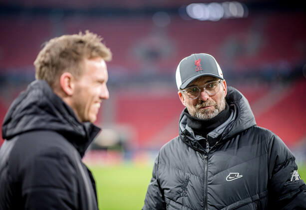 Liverpool coach Juergen Klopp and Leipzig coach Julian Nagelsmann stand together and talk UEFA Champions League Round of 16, second leg FC Liverpool RB Leipzig 2 0 10 03 2021, Puskas Arena in Budapest Hungary FC Liverpool RB Leipzig
