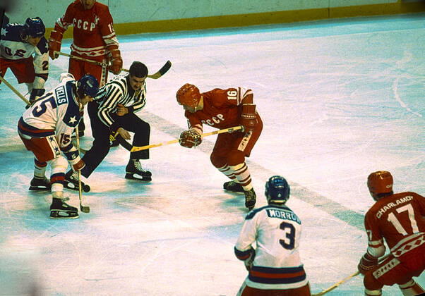 1980 Olympic Winter games, Winterspiele,Spiele, Summer games USA Ice hockey, Eishockey Mark Wells (USA) and Vladimir Petrov (USSR) face off during the Men s Ice Hockey semi-final at the 1980 Olympic Winter Games. Lake Placid New York United States Copyright: xPaulxJxSutton DUOMO PCNx IH0101_80005